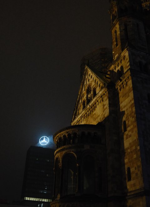 I loved how the Mercedes logo seemed to be floating there right next to the church in the fog. It made me think of how the things that society worships nowadays are often these perceived symbols of status and wealth.